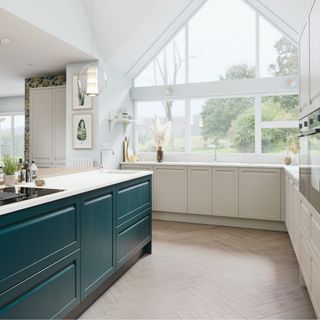 kitchen with cashmere cabinets, wooden flooring, glass pendant lighting and teal and white island