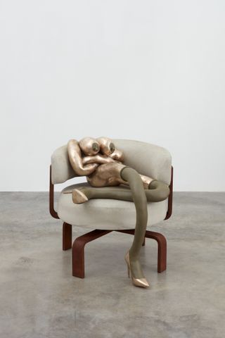 Figure in chair
