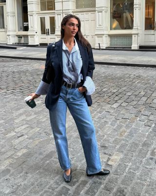 @sandrashehab wearing a blazer, button-down shirt, straight-leg jeans, and court shoes in New York