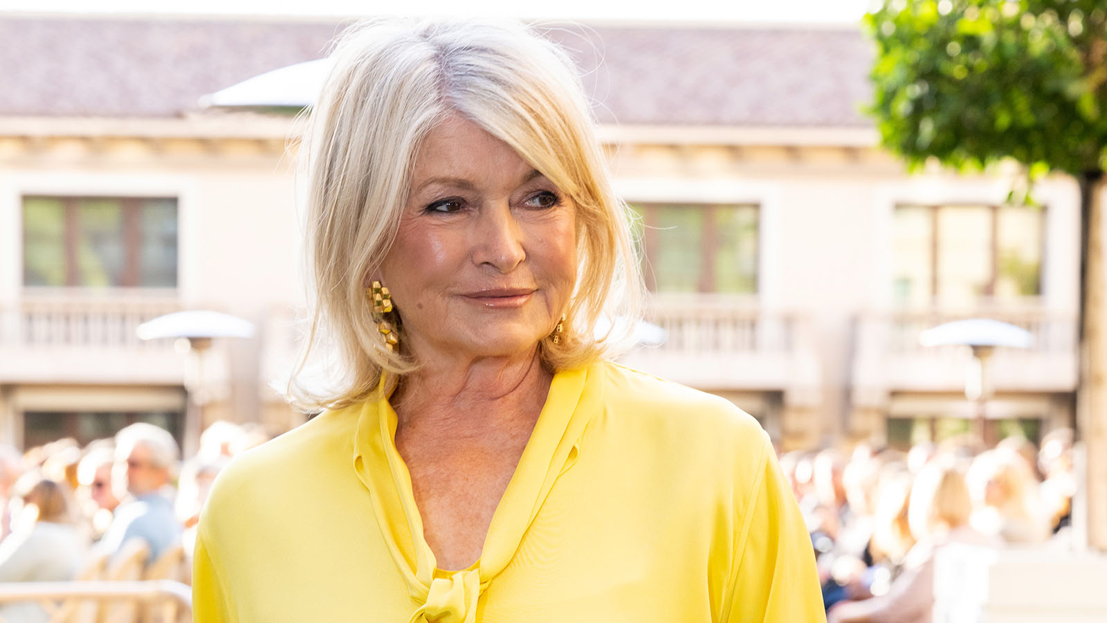Martha Stewart in a yellow blouse