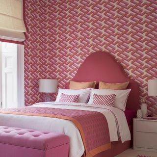 girl's bedroom with plush pink headboard bed
