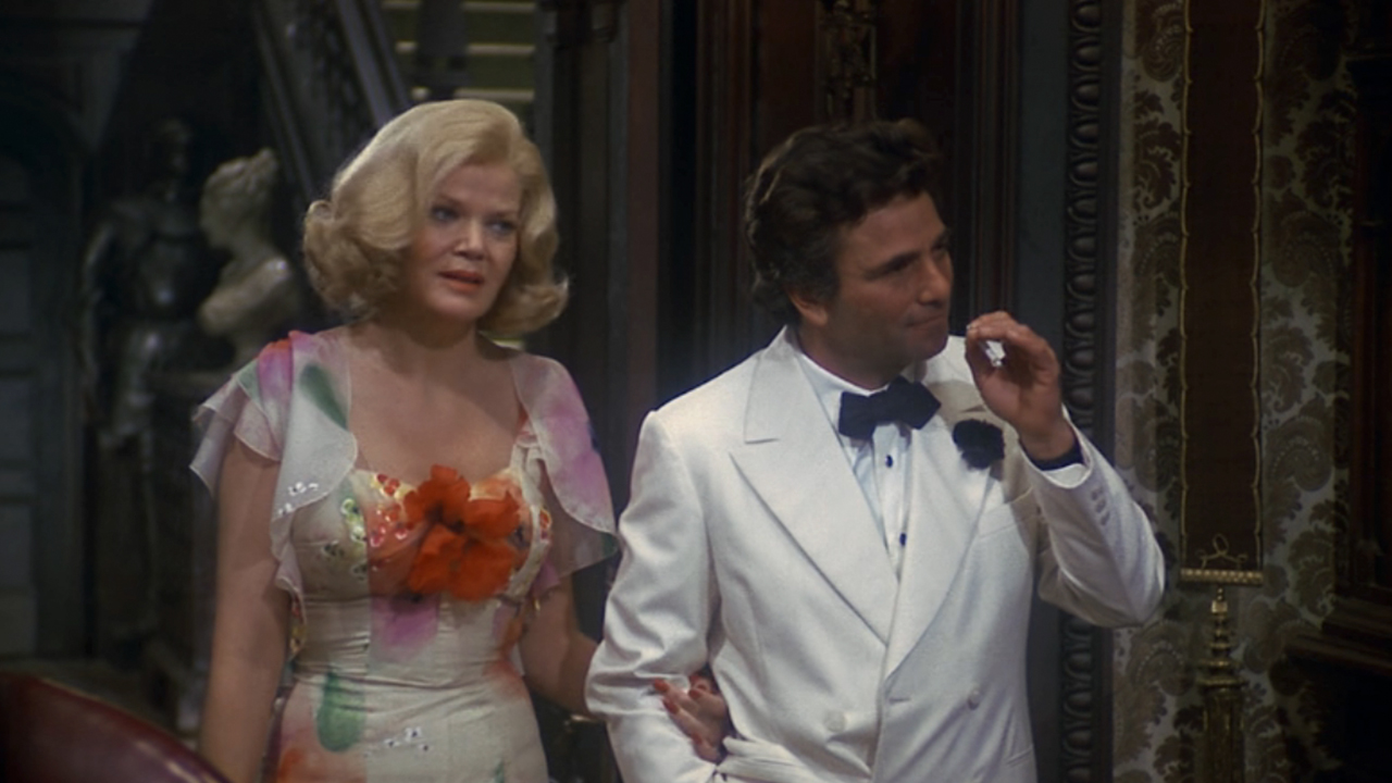 Eileen Brennan in a flowery dress and Peter Falk in a white dinner jacket in Murder by Death