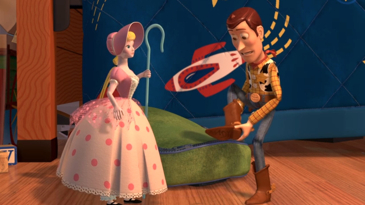 Bo Peep looking at Woody as he looks under his boot in Toy Story 2