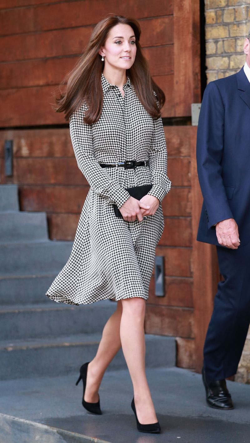 Showing off her newly-minted bangs, Middleton is breezy in a houndstooth Ralph Lauren shirtdress with a waist-cinching black belt.