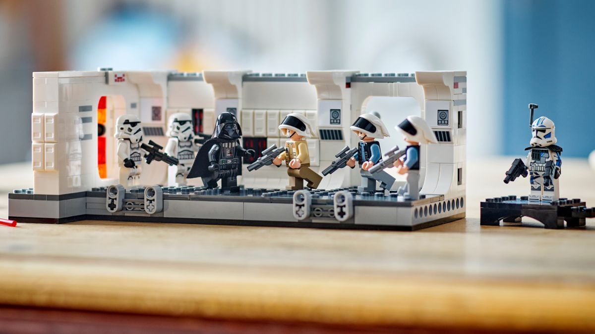 Lego Boarding the Tantive IV set laid out with minifigures on a tabletop