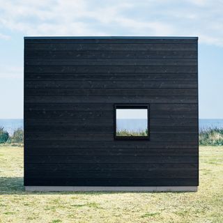 grey hut with window