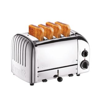 A silver toaster with four slices of toast coming out of it, a chrome exterior, and black handles, knobs, and feet