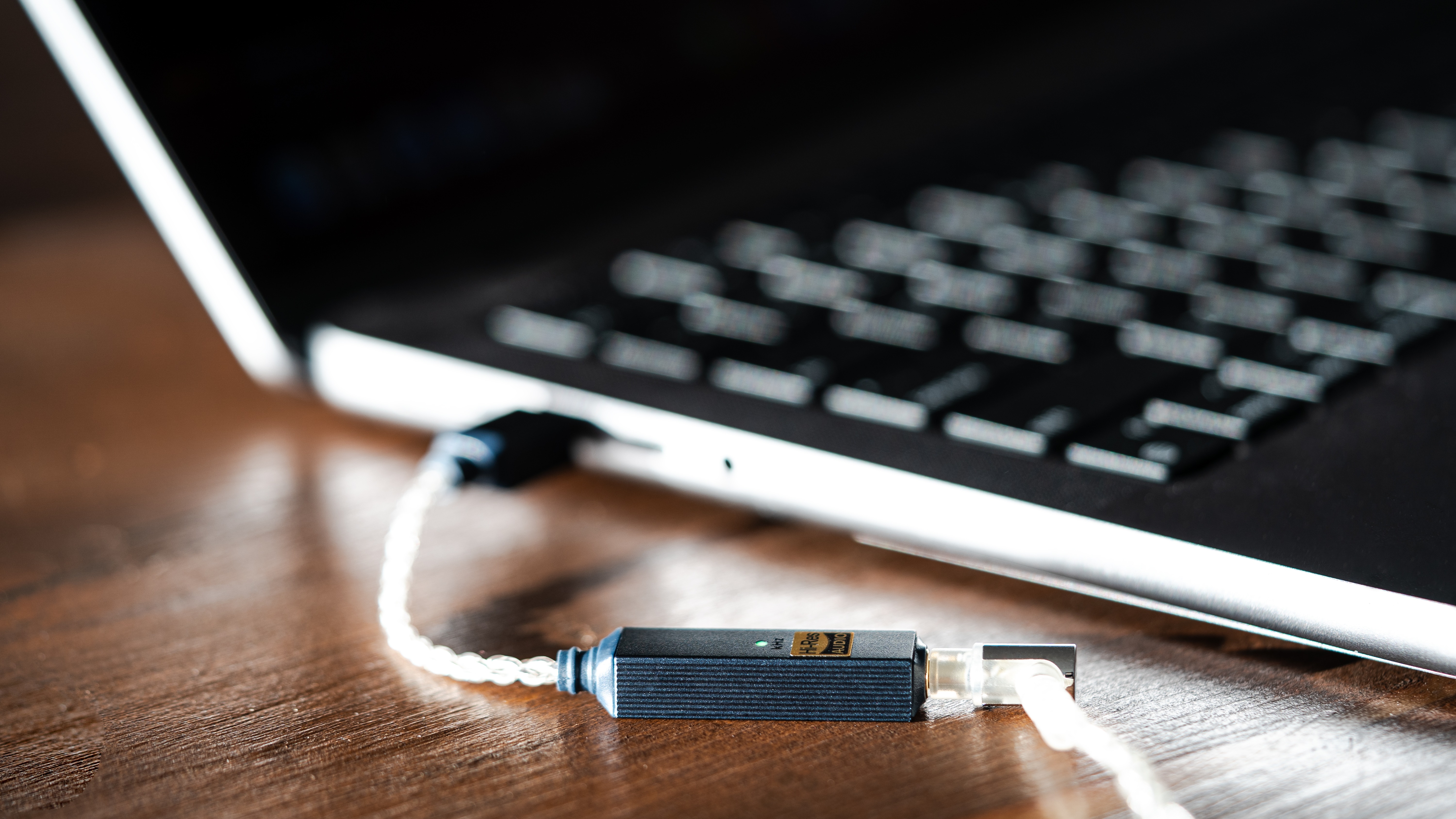 iFi Go Link 2 portable DAC connected to a laptop