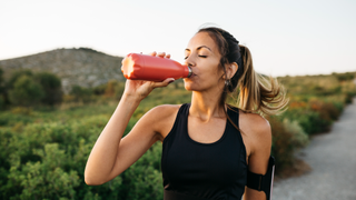 Woman drinking from a water bottle