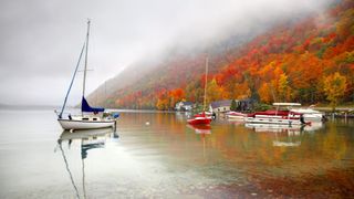 Fog and boats on Lake Willoughby, Vermont in autumn