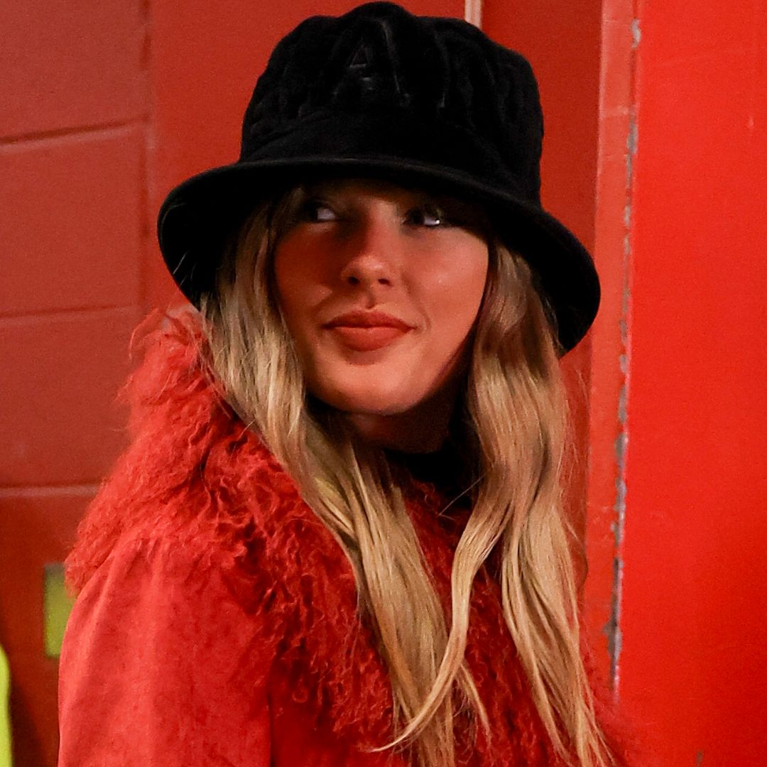 Taylor Swift arriving at Arrowhead Stadium in a red Charlotte Simone coat