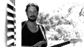 Chris Rea holding a guitar 