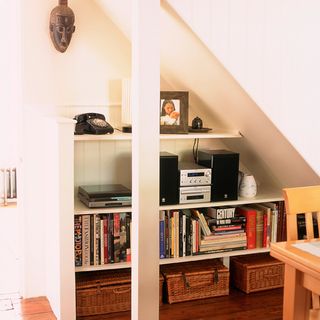 hallway with book shelf and wooden floor