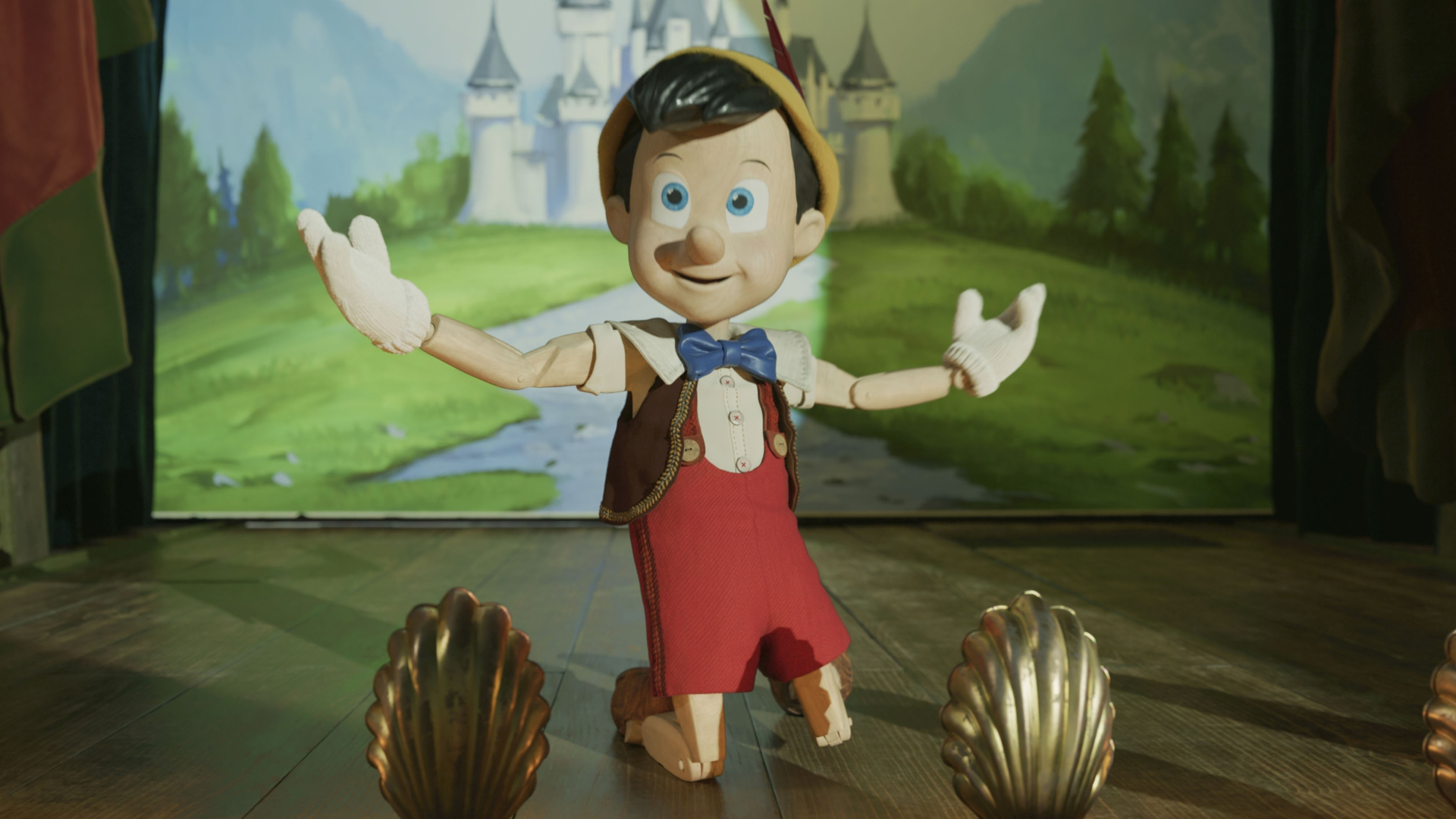 Pinocchio laps up the applause as he stars in Stromboli's act in the live-action Pinocchio remake