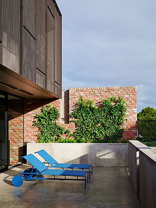 A decked terrace accessible via the living room is the house's centrepiece