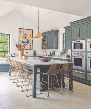 Blue kitchen with island and seating