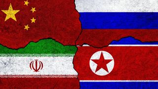 Flags of Iran, China, Russia and North Korea on a wall. China North Korea Iran Russia alliance