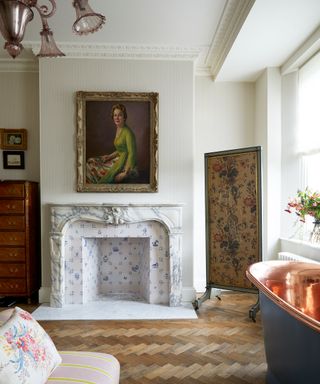 Vintage bathroom with parquet flooring and marble fireplace