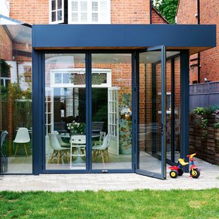 conservatory with navy blue colour and trycycle
