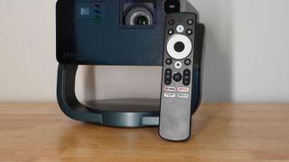 Epson EF-22 projector on table with remote