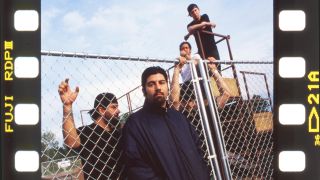 Deftones by a gate in a parking lot in 2000