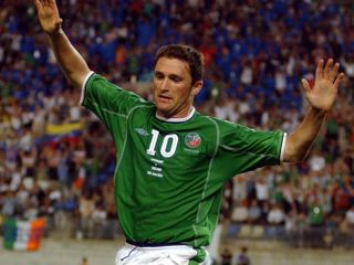 Robbie Keane celebrates after scoring a stoppage-time equaliser for the Republic of Ireland against Germany at the 2002 World Cup