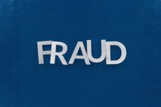 silver letters spelling the word fraud