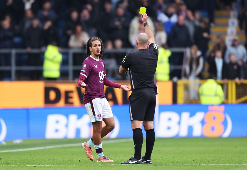BURNLEY, ENGLAND - OCTOBER 18: Hannibal Mejbri of Burnley is shown a yellow card by referee during the Premier League match between Burnley and Leeds United at Turf Moor on October 18, 2025 in Burnley, England. (Photo by Alex Livesey/Getty Images)