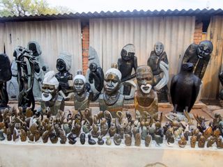 Statuettes carved from stone at a marketplace in Victoria Falls, Zimbabwe.
