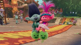 Poppy and Branch singing in a still from Trolls Band Together