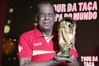 Brazil's 1970 World Cup-winning captain Carlos Alberto holds the trophy ahead of th 2014 World Cup in his homeland.