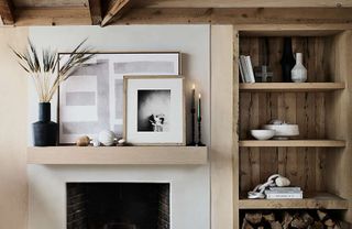 Living room mantel with white pumpkin display