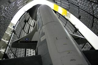 The U.S. Air Force's classified X-37B space plane is prepared for its first spaceflight, OTV-1, in April 2010. The same space plane launched on the third X-37B mission, OTV-2, on Dec. 11, 2012. As of Aug. 29, 2014, the mission has reached 627 days in space and counting.