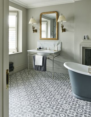Grey bathroom with patterned floor tiles