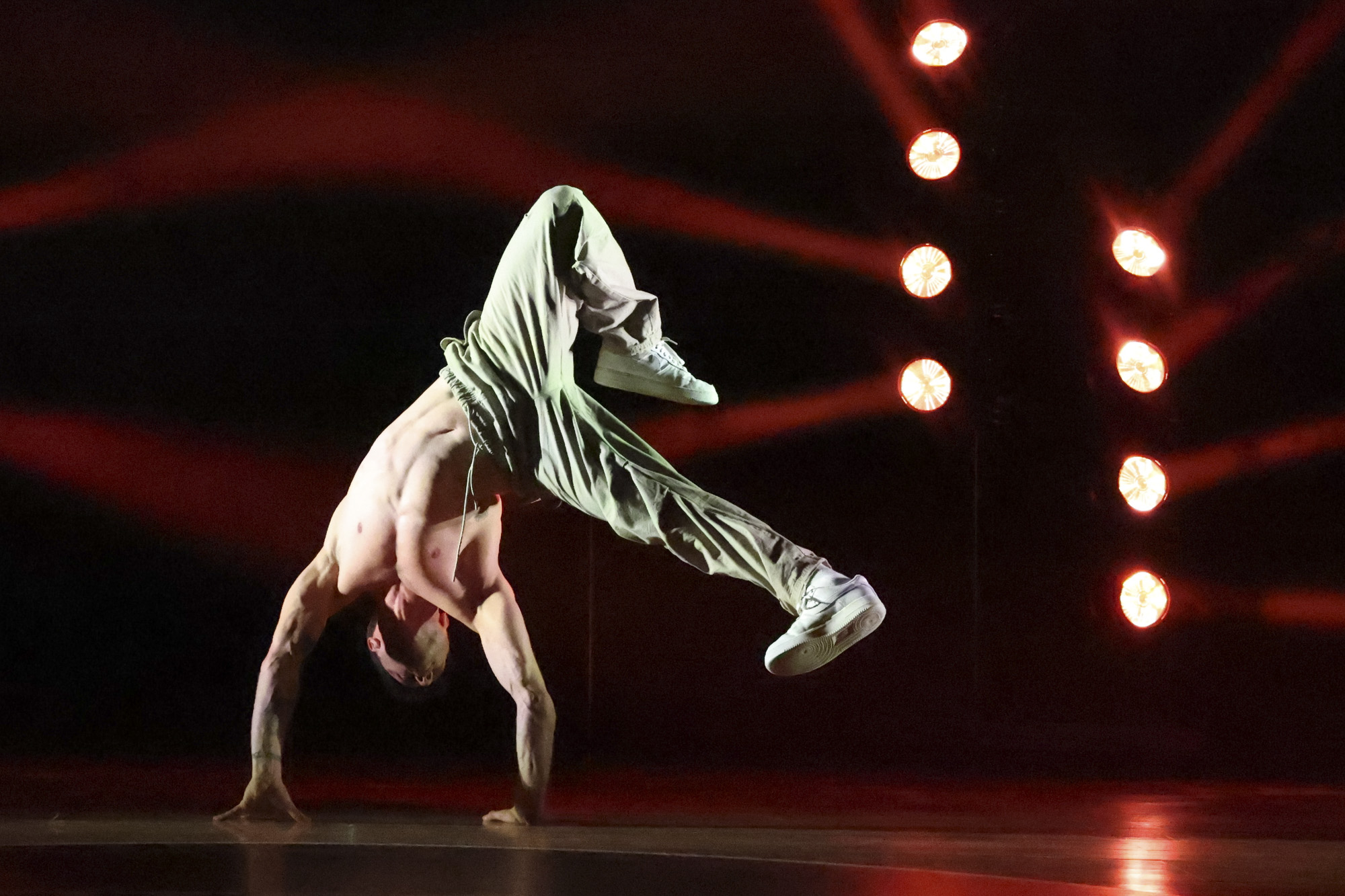 Zoomed in photo of breakdancer in stage