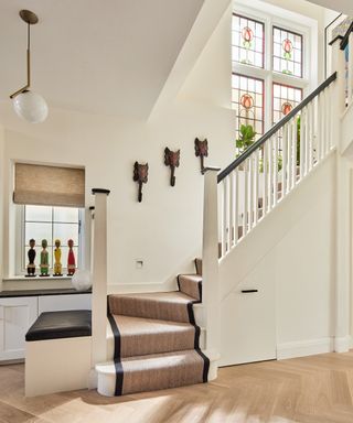 A new stair case with newly installed stained glass windows 