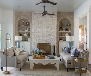 Herlong Architecture and Interiors living room with a fireplace and a symmetrical layout