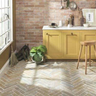 stone flooring laid in a herringbone pattern