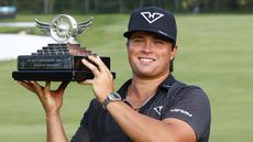 Michael La Sasso lifts the LIV Golf Indianapolis trophy after winning the final event of the 2026 season