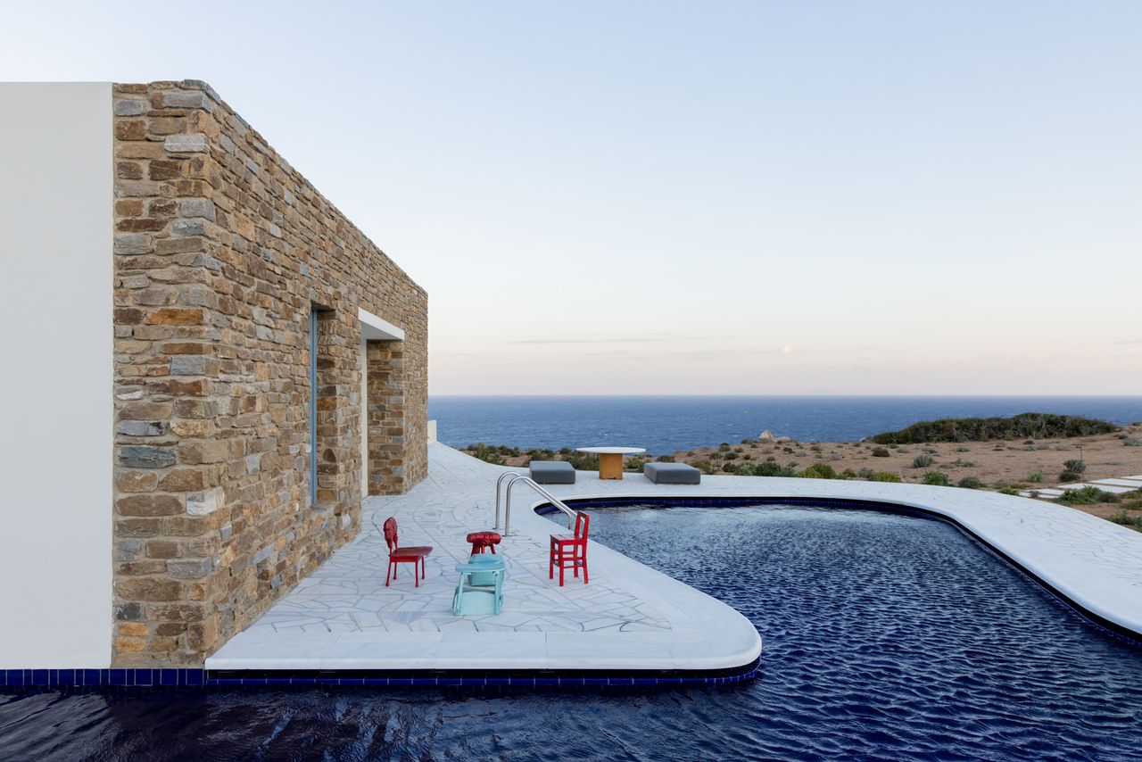 Peninsula House in Antiparos, Greek islands, with swimming pool, white volumes and colourful furniture