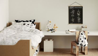 Child's bedroom in monochrome design with light woods. A lego astronaut stands on the desk.