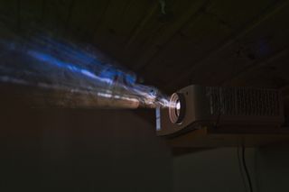 Colourful projector beam through smoke