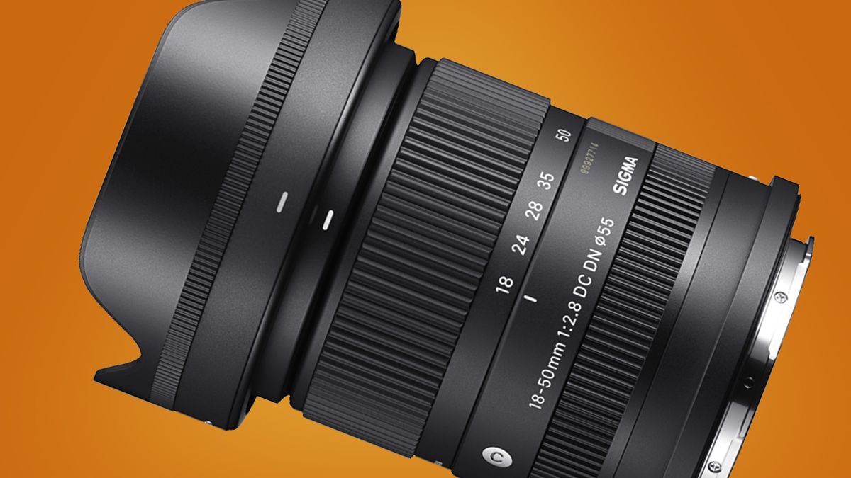 The Sigma 18-50mm f/2.8 DC DN Contemporary on a orange background