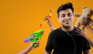 Amit Tandon: Family Tandoncies Amit surrounded by hands holding toys