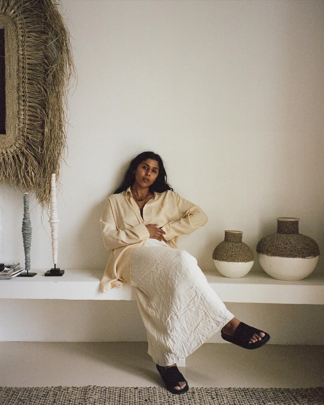 @monikh wearing a linen shirt and skirt