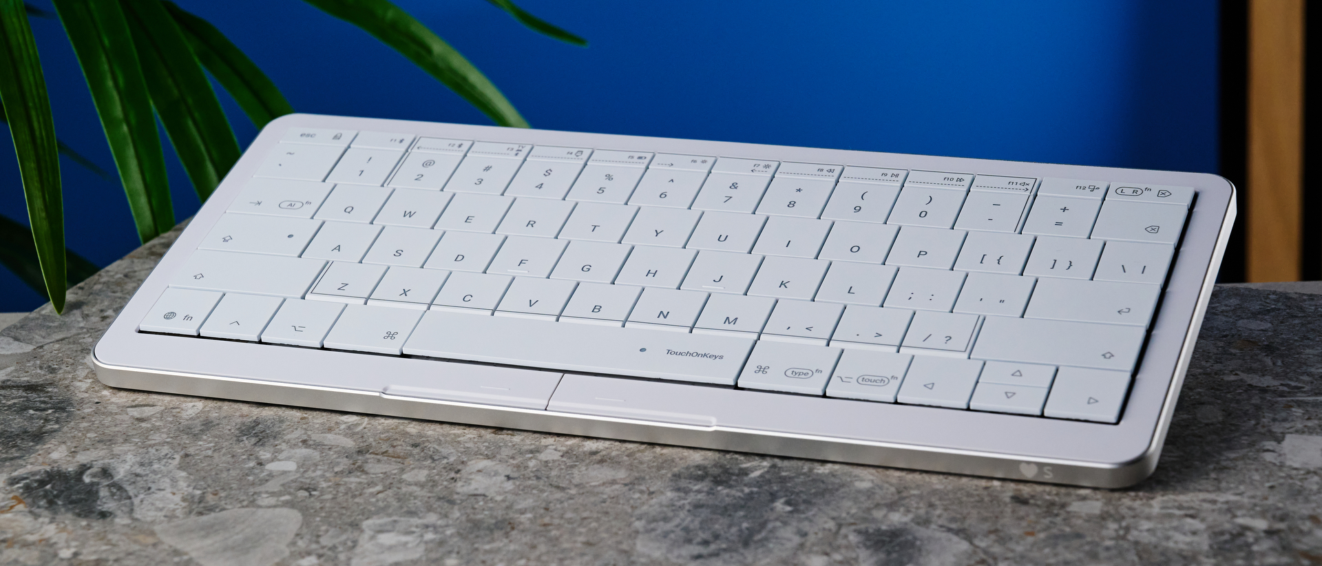 A white Clevetura CLVX S keyboard