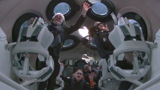 Four private astronauts float around the cabin of a spaceplane with varying looks of excitement on their faces.