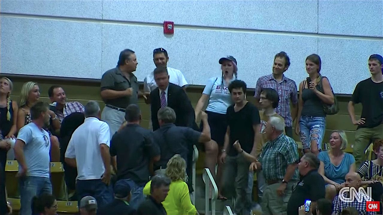 Donald Trump supporter gets ready to hit a protester as Asheville rally