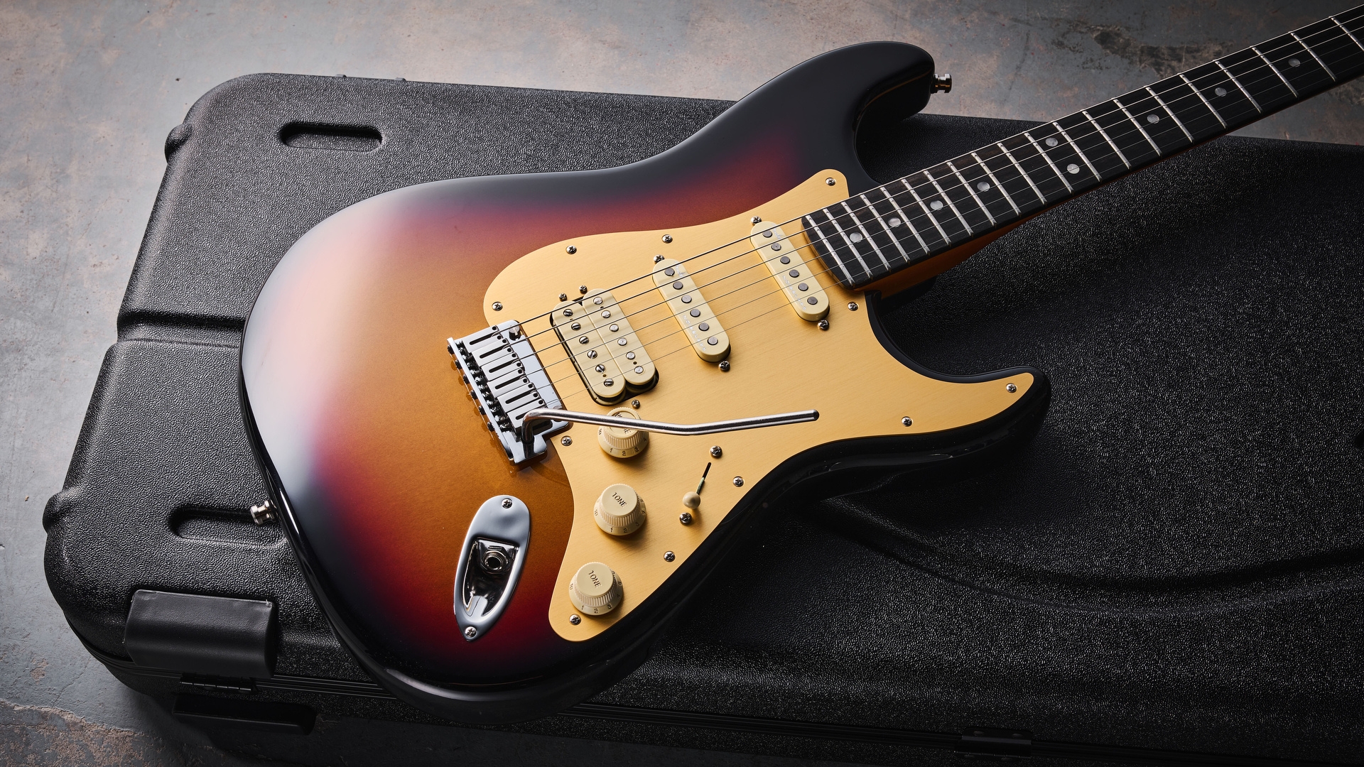 A Fender American Ultra II Stratocaster on a guitar case