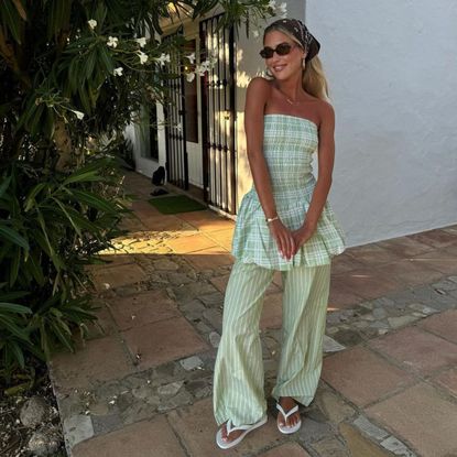 Emili Sindlev wearing stripe linen trousers